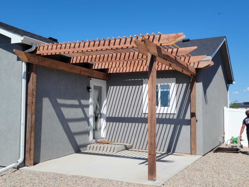 J&B Creative Constructs built this back door pergola that now provides shade to their backyard porch.